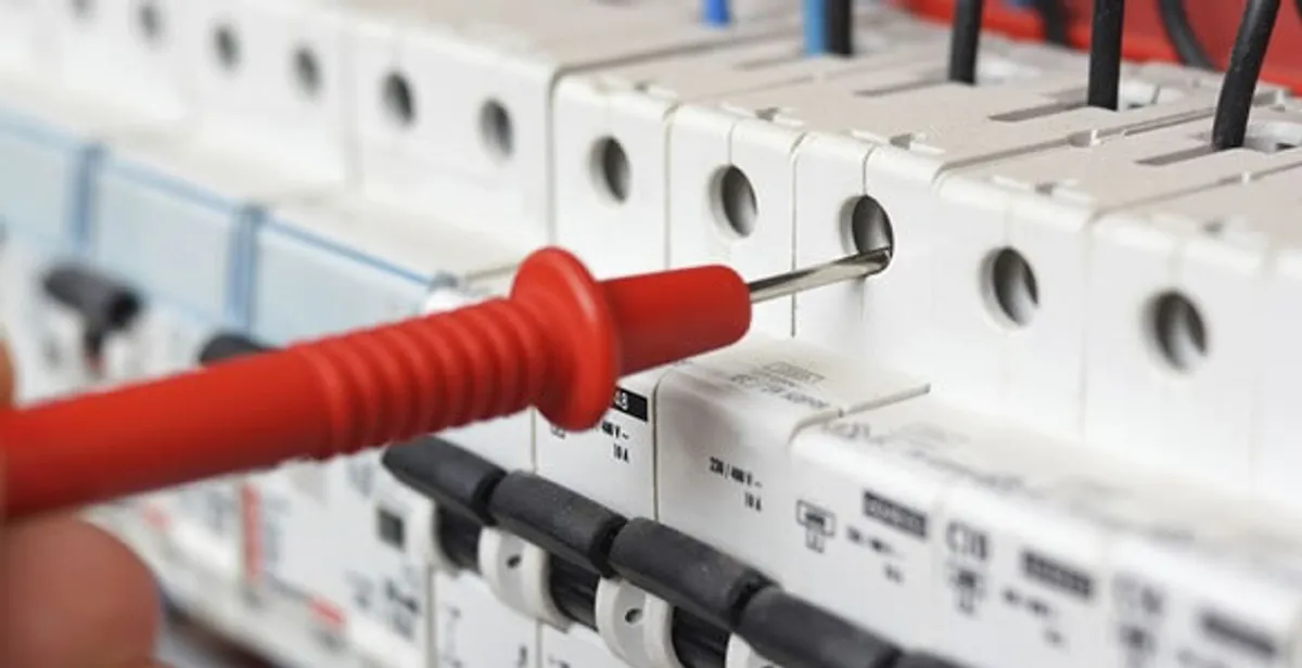 Electrical contractor testing circuit breakers during electrical repair in Opa Locka, FL