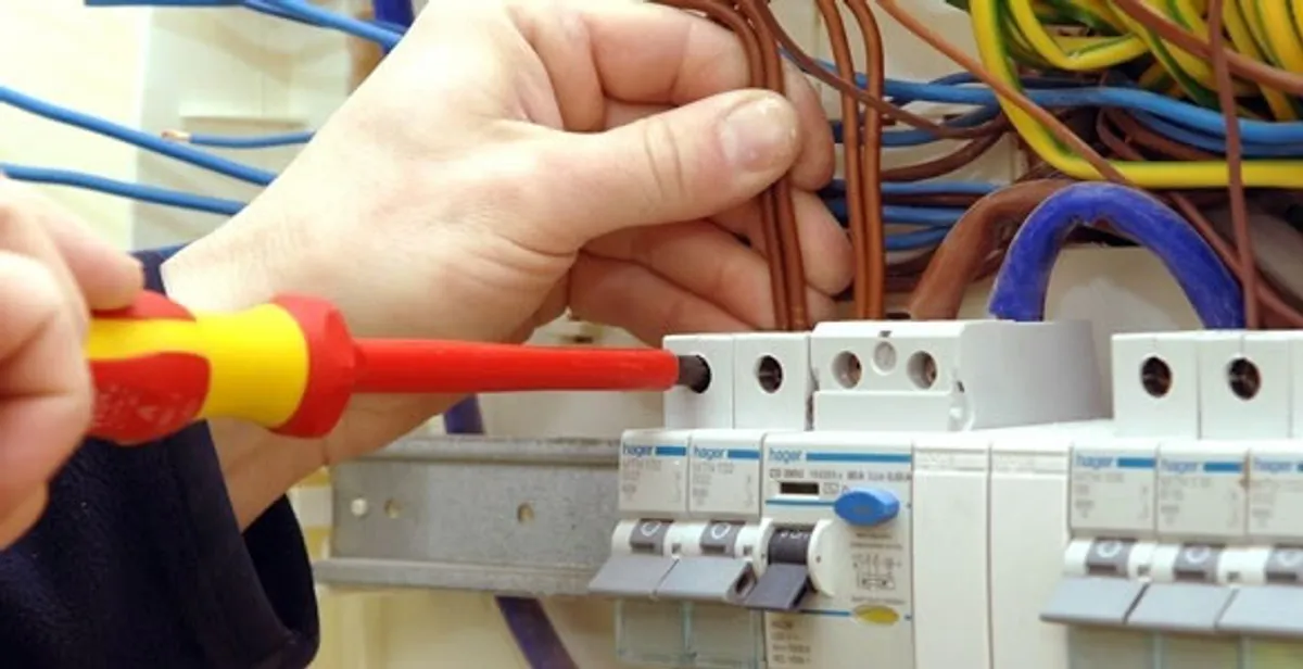 electrician services performing professional electrical panel wiring and connections in Miami, FL