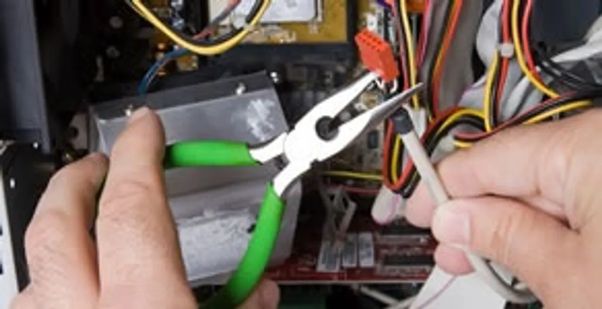 Licensed electrical contractor performing electrical repair with tools in Miami Beach, FL